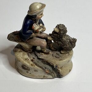 Vintage Antique Ceramic Figurine Seated Boy Holding Bird with Dog